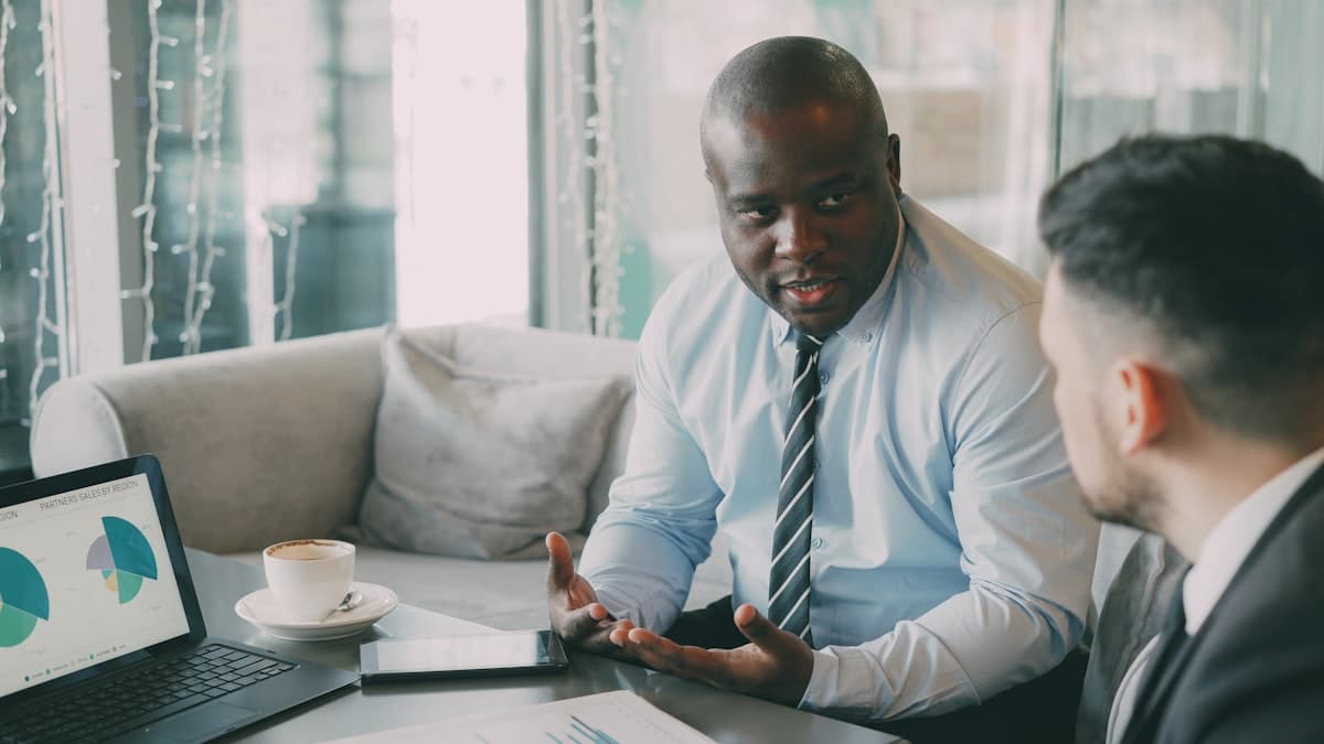 Developer working on code with colorful syntax on screen
